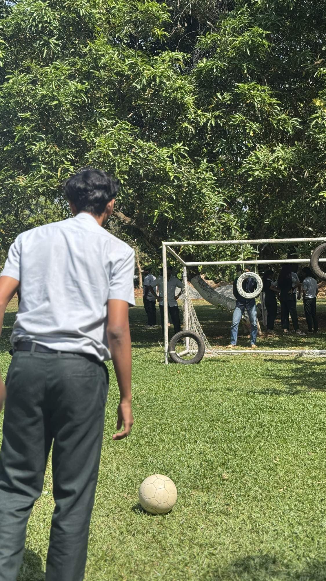 Student taking part in an outdoor ball activity during Edge Plus