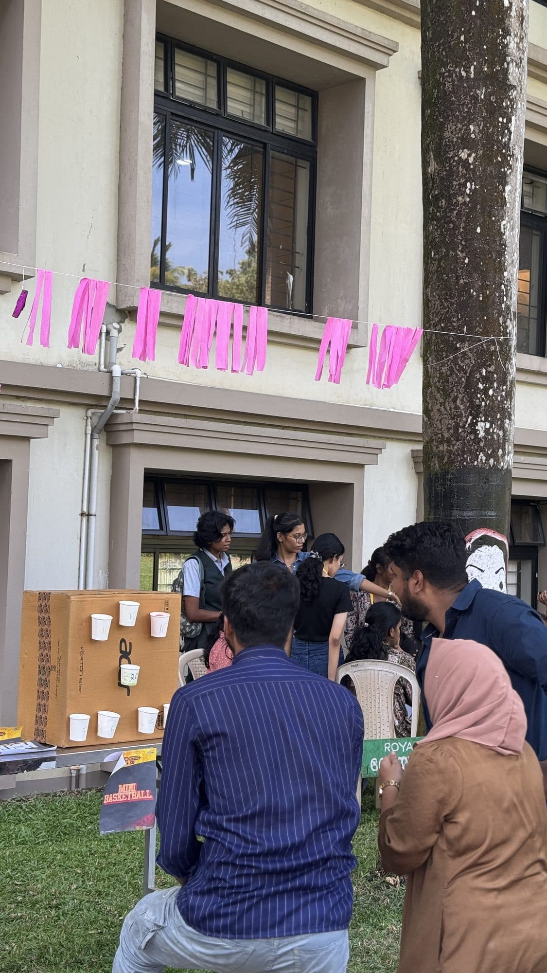 Students participating in an Edge Plus activity outside a building