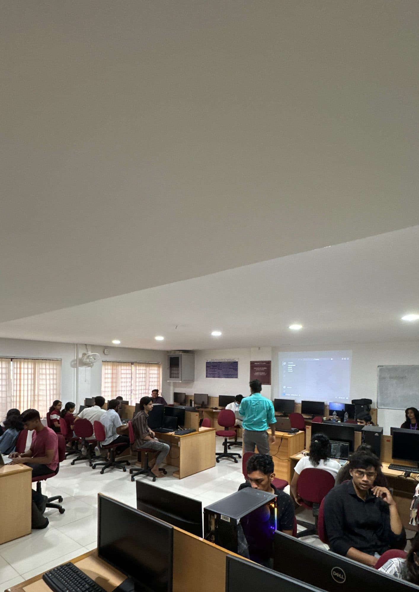 Audience seated in a hall during an Edge Plus session