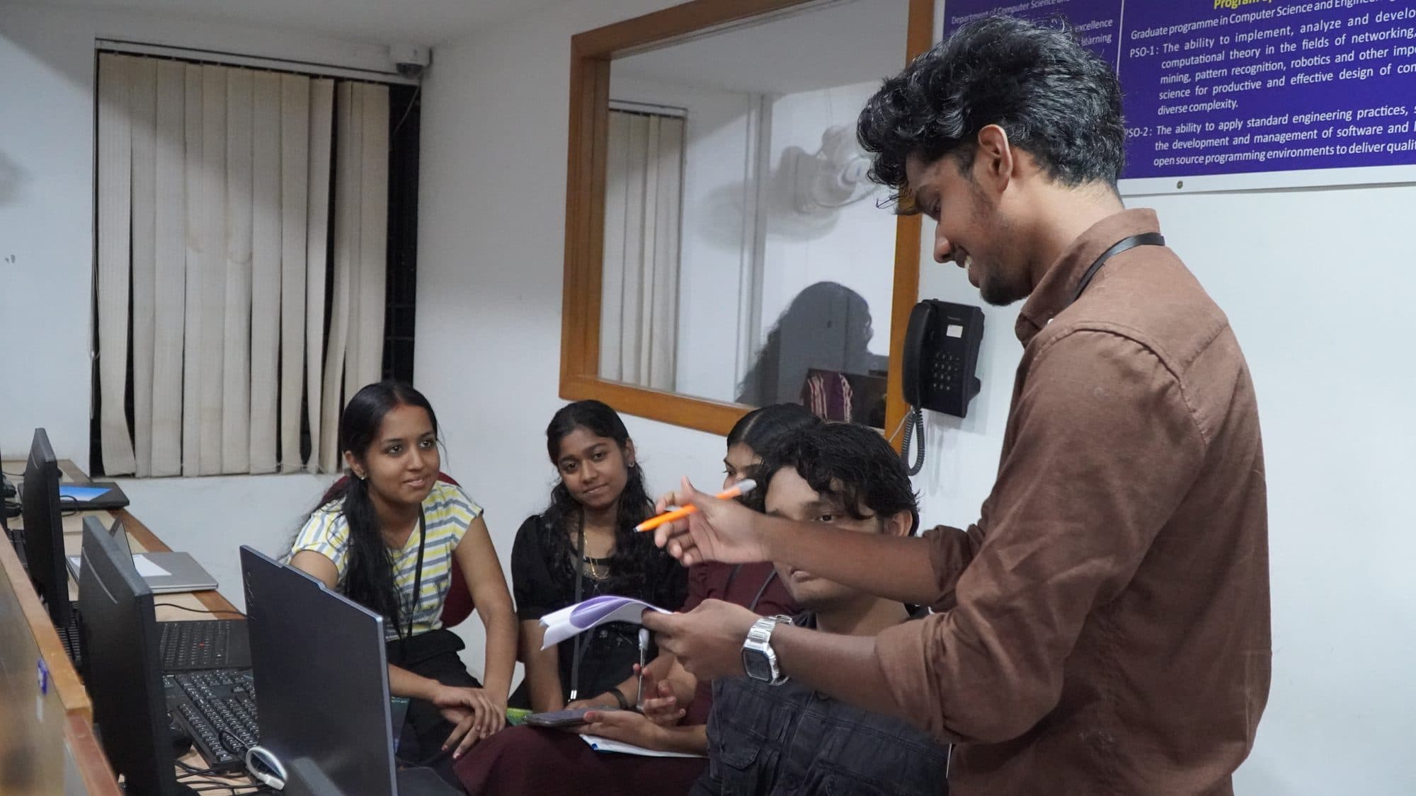 Students working together on laptops during HackFit