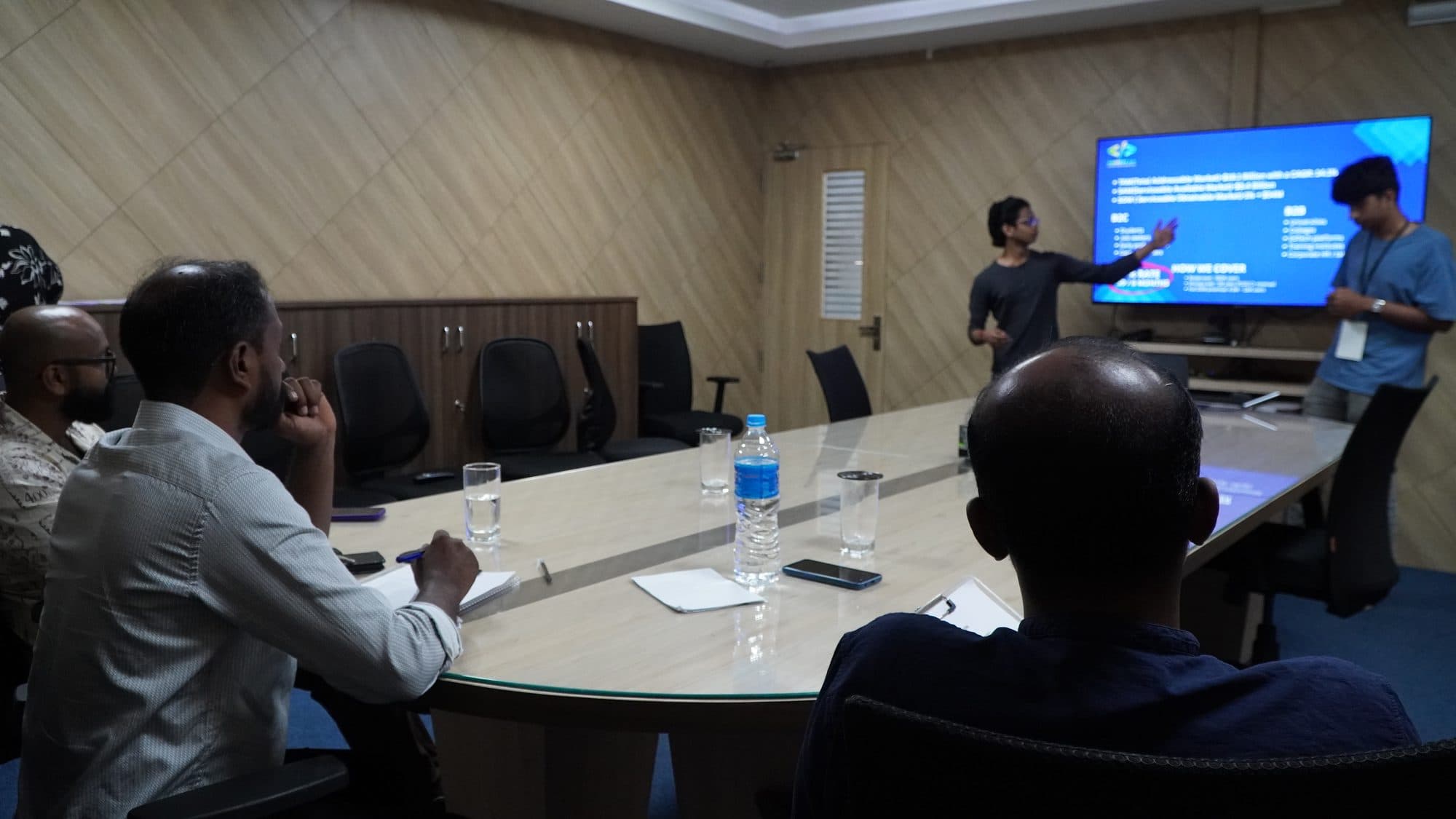 Participants working on laptops during a HackFit session